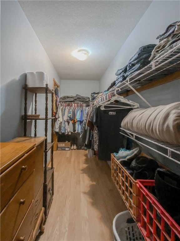 walk in closet featuring light wood-type flooring