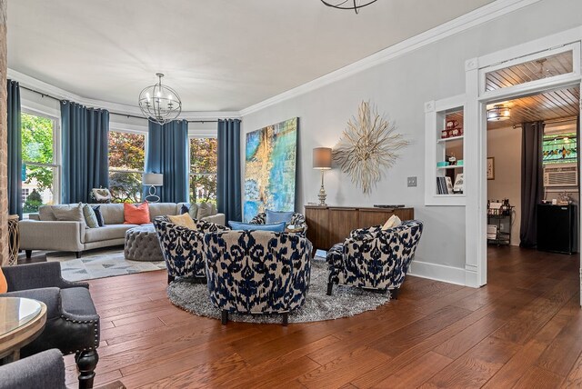 living room with dark hardwood / wood-style floors, ornamental molding, and a chandelier