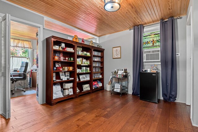 miscellaneous room with a wealth of natural light, wood ceiling, and dark hardwood / wood-style flooring