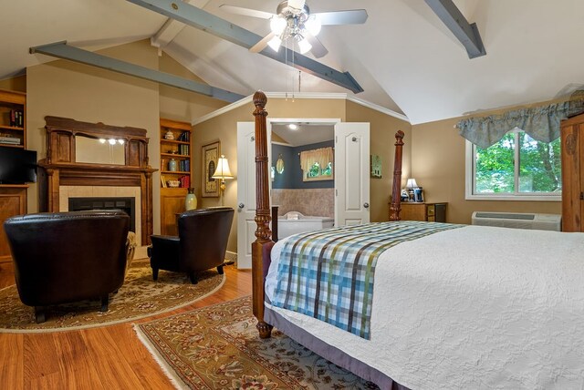 bedroom featuring ceiling fan, lofted ceiling with beams, a wall mounted AC, and light hardwood / wood-style floors