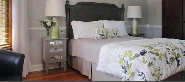 bedroom featuring dark wood-type flooring