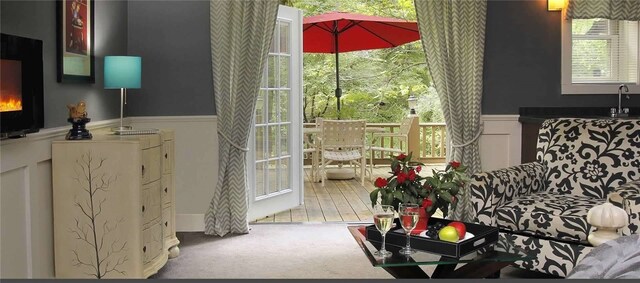 carpeted living room featuring sink