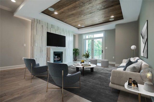 living room featuring a raised ceiling, wood ceiling, and dark hardwood / wood-style flooring