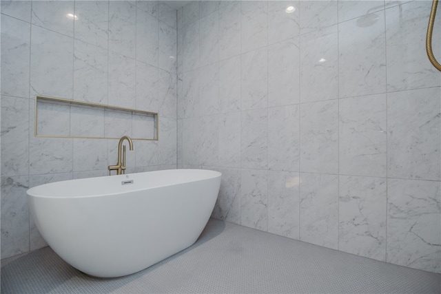 bathroom with tile walls