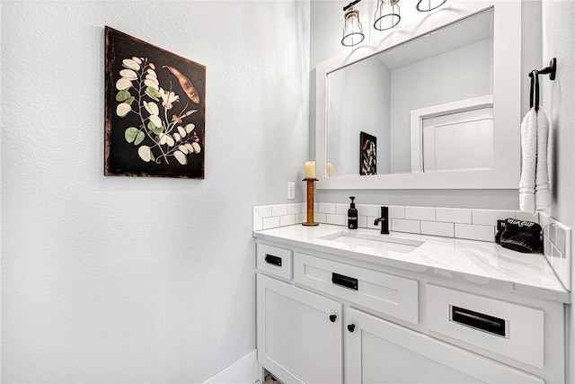 bathroom with backsplash and vanity