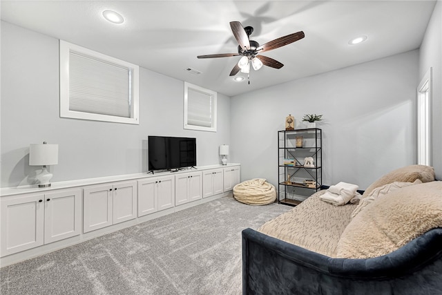 living room featuring ceiling fan and light carpet