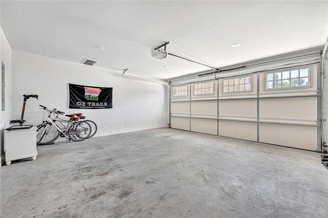 garage featuring a garage door opener