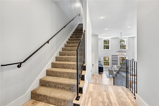 stairway with light wood-type flooring