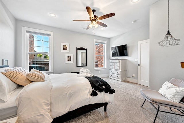 carpeted bedroom featuring ceiling fan