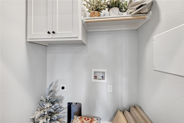 laundry room featuring electric dryer hookup, cabinets, and hookup for a washing machine