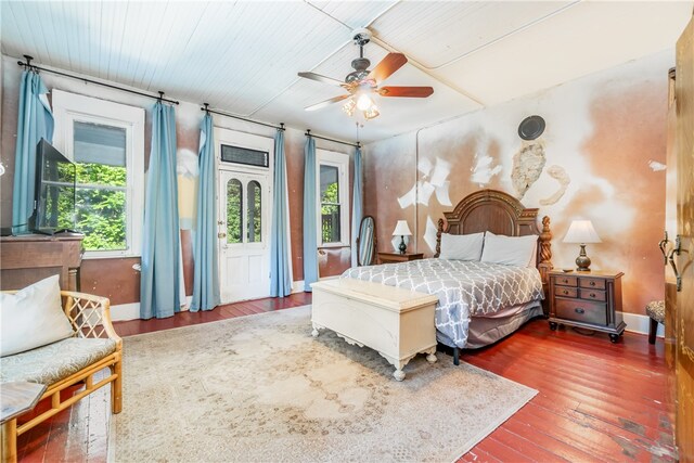 bedroom with ceiling fan and dark wood-type flooring