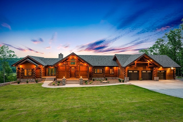 log home with central AC unit, a garage, and a lawn