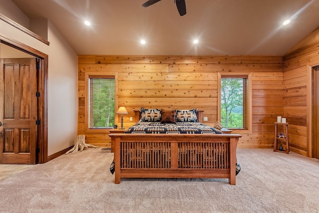 bedroom featuring ceiling fan, lofted ceiling, and light colored carpet