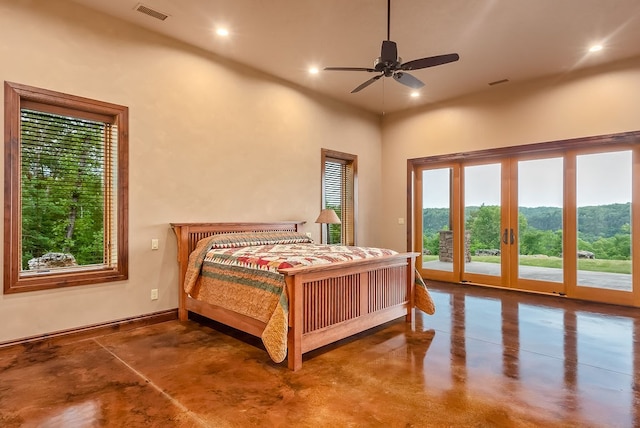 bedroom featuring a high ceiling, ceiling fan, access to exterior, and french doors