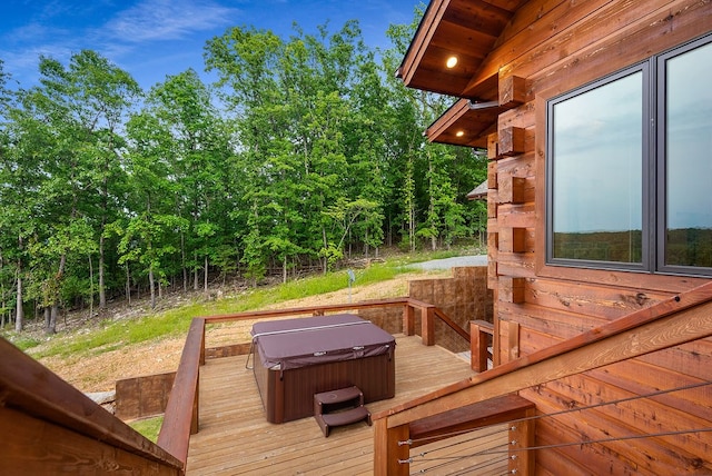 deck featuring a hot tub