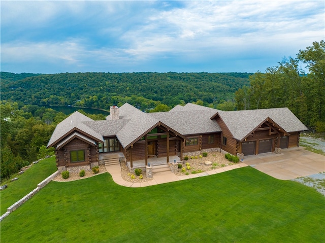 log-style house with a front lawn and a garage