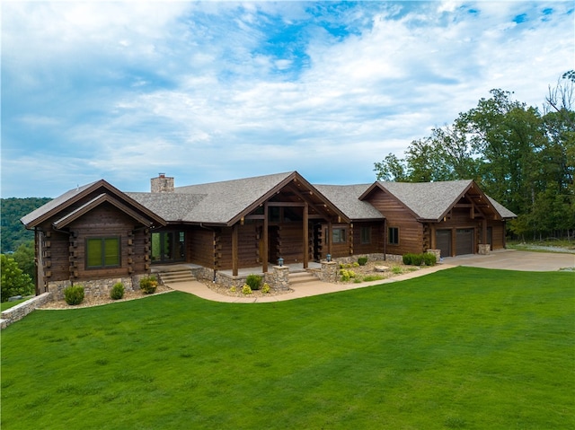 log-style house with a front lawn and a garage