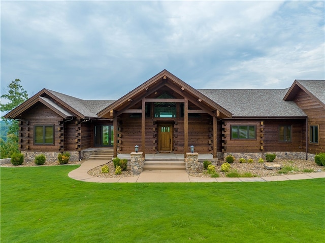 cabin with a front lawn