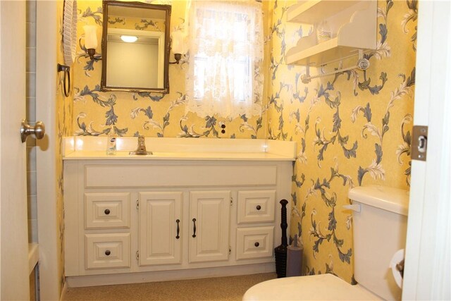 bathroom with vanity and toilet