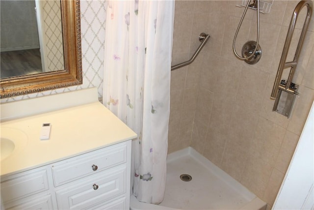 bathroom featuring vanity and a shower with shower curtain