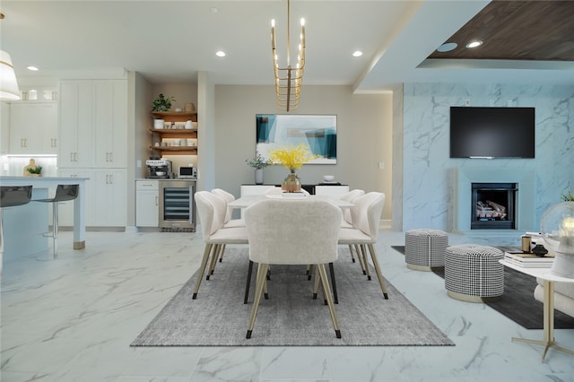 tiled dining room with wine cooler and a notable chandelier