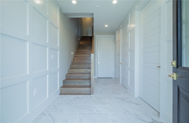 stairs featuring light tile floors