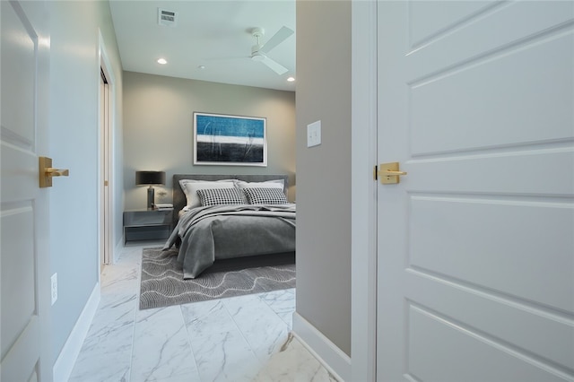 tiled bedroom featuring ceiling fan