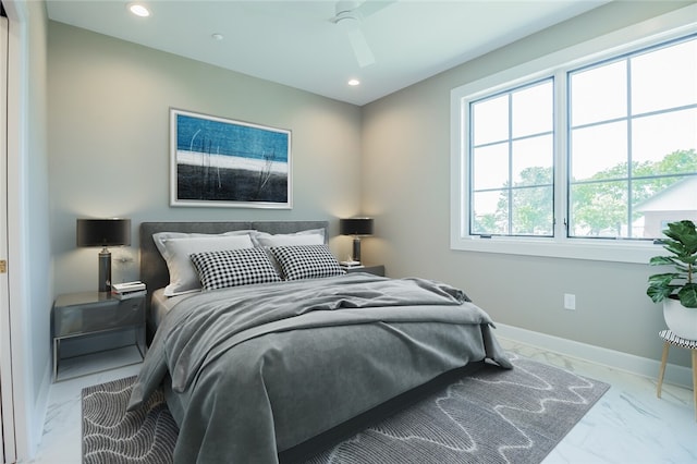 bedroom featuring ceiling fan and light tile floors