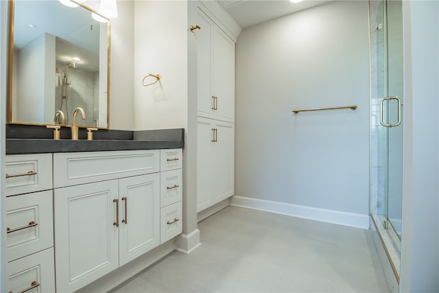 bathroom featuring an enclosed shower and vanity