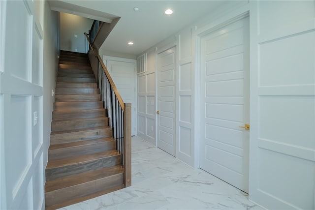 stairs with light tile floors