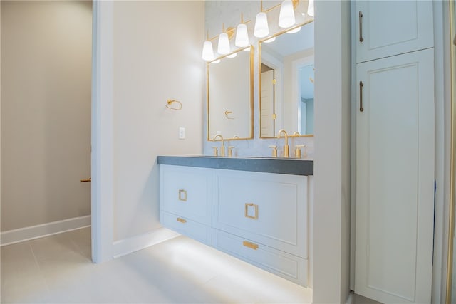 bathroom featuring backsplash, tile floors, and vanity