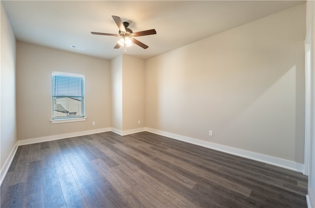 unfurnished room featuring dark hardwood / wood-style floors and ceiling fan