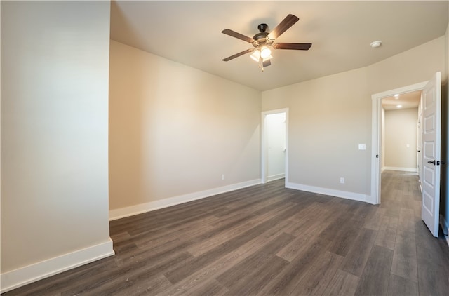 spare room featuring ceiling fan and dark hardwood / wood-style flooring