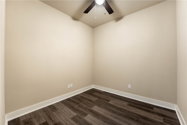 spare room with dark hardwood / wood-style floors and ceiling fan