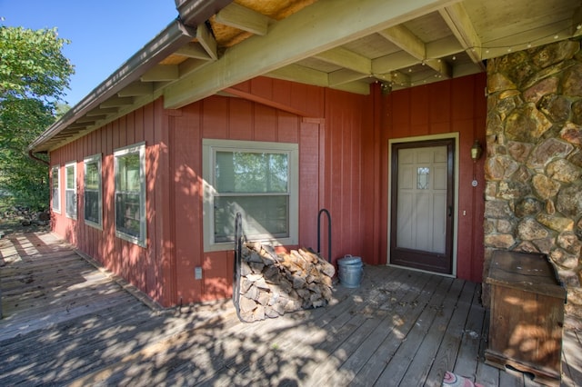 view of exterior entry with a deck