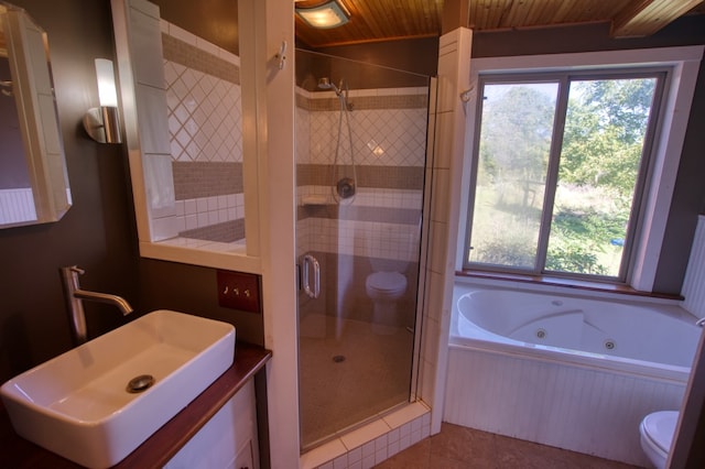 full bathroom with independent shower and bath, toilet, wood ceiling, sink, and tile floors