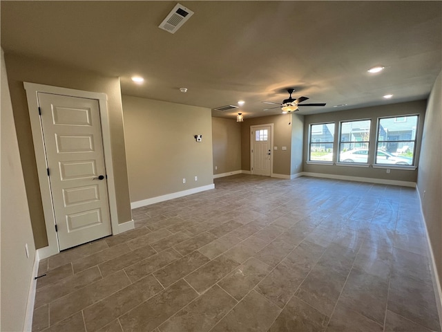 tiled empty room with ceiling fan