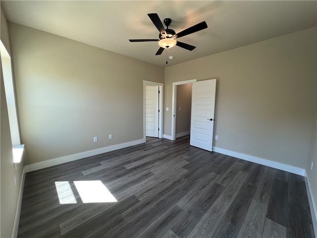 unfurnished bedroom with dark hardwood / wood-style floors and ceiling fan