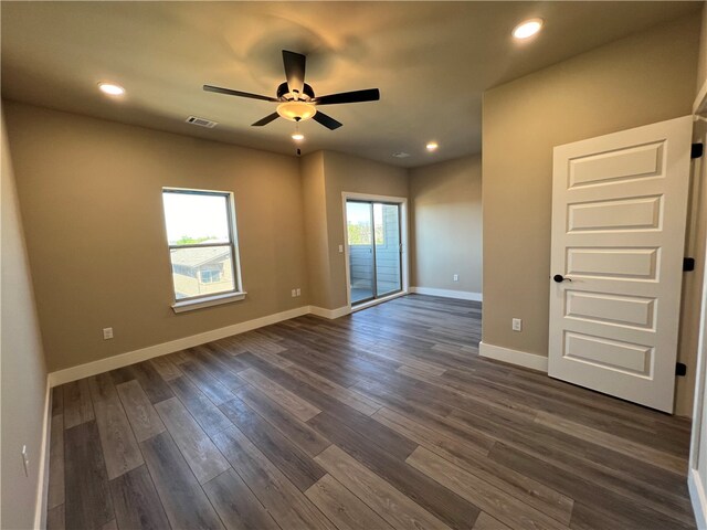 unfurnished room featuring ceiling fan and dark hardwood / wood-style floors