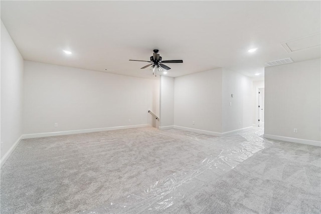 spare room featuring ceiling fan and light carpet