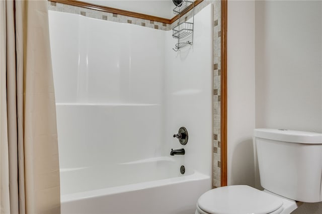 bathroom with toilet and shower / washtub combination