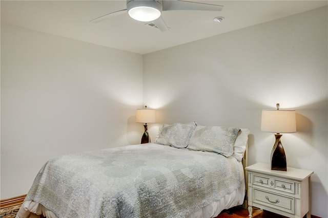 bedroom featuring dark wood-type flooring and ceiling fan