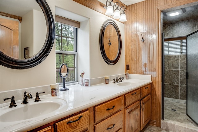 bathroom featuring dual bowl vanity, tile floors, and tiled shower