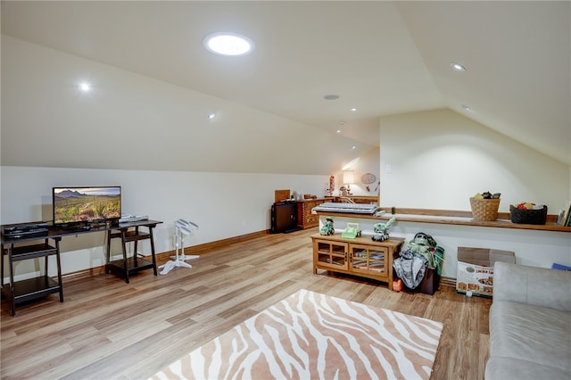 sitting room featuring light hardwood / wood-style flooring and lofted ceiling