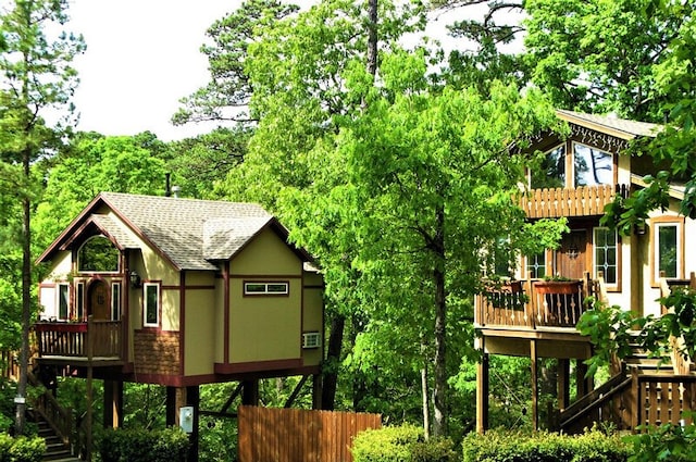 back of house featuring a deck