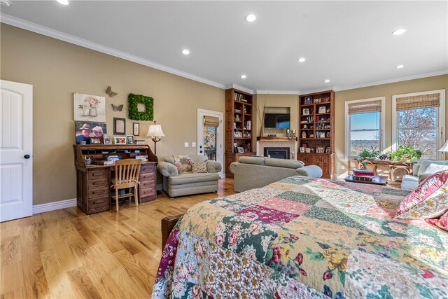 bedroom featuring light hardwood / wood-style flooring and ornamental molding