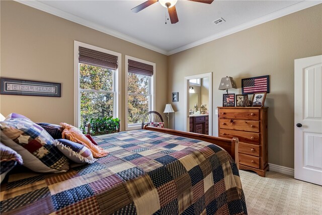 bedroom featuring ceiling fan, crown molding, light carpet, and connected bathroom