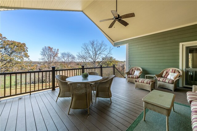 wooden terrace featuring ceiling fan