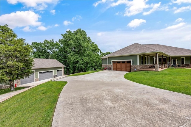 view of front of house with a front yard and a garage