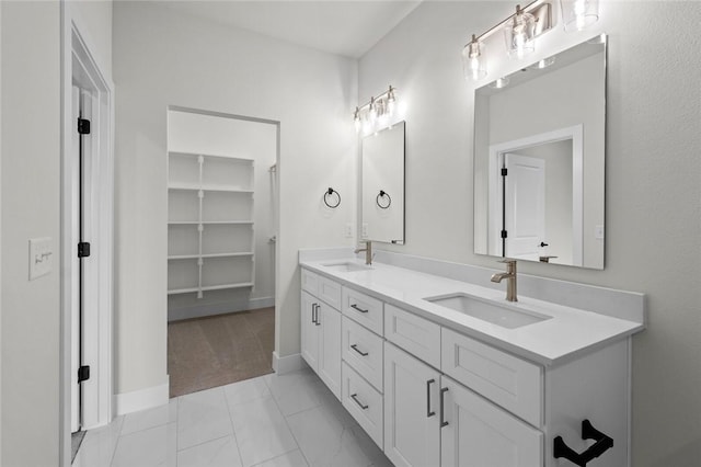 3058 W Berkeley Ave, Rogers, AR 72758 - bathroom featuring double vanity and marble finish flooring